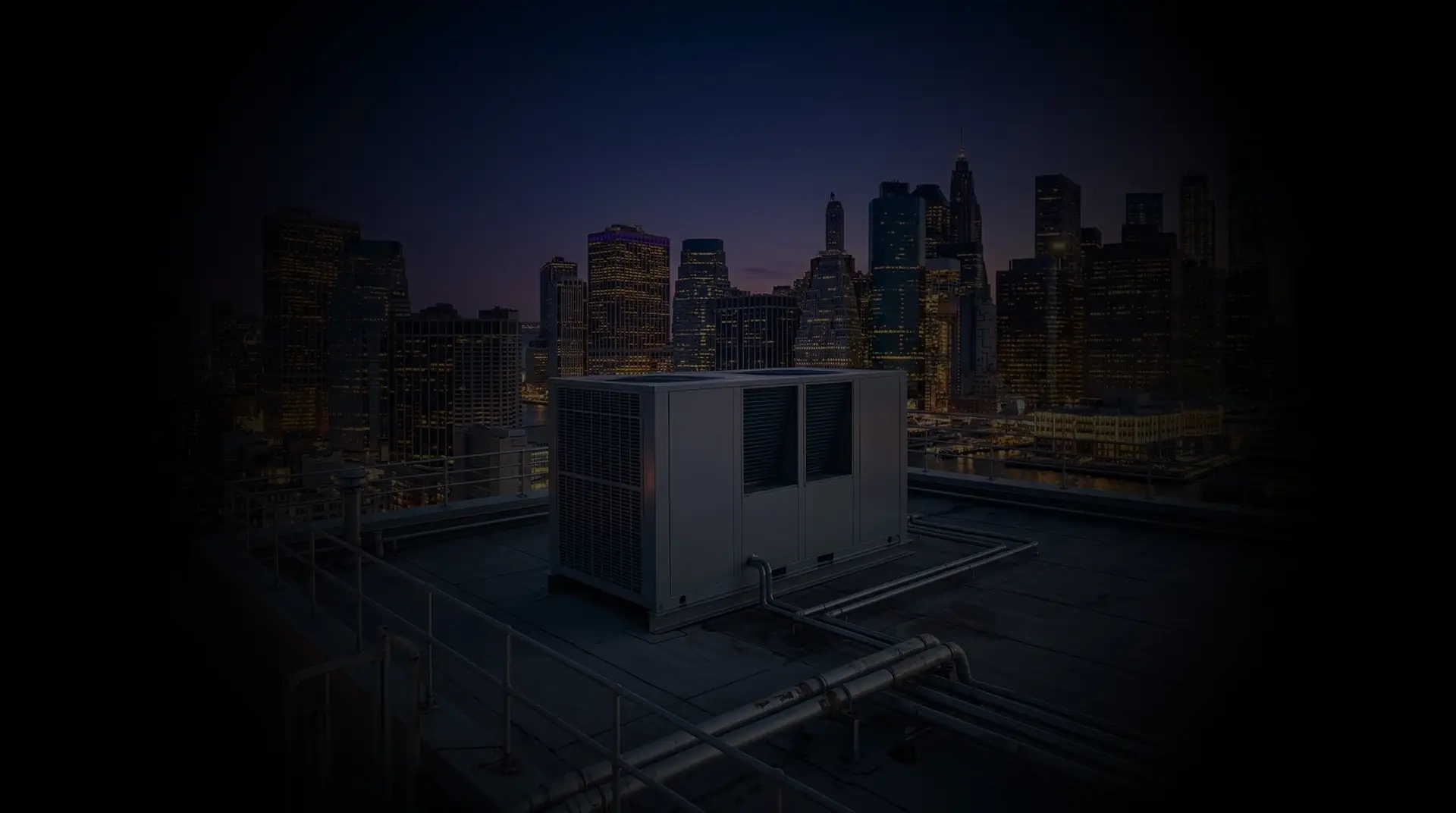 New York skyline at dusk behind a rooftop unit
