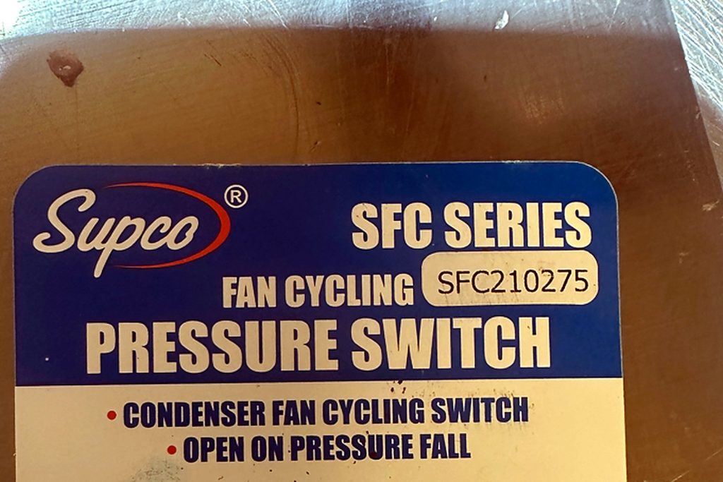 Supco SFC series SFC210275 condenser fan cycling pressure switch in its packaging, labelled open on pressure fall