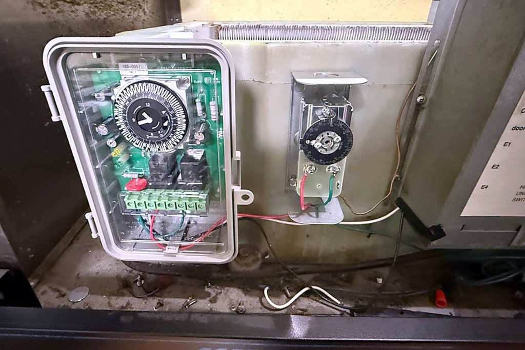 Second box, second visit: the new electronic timer in its grey enclosure mounted beside the old mechanical timer on the Hoshizaki reach-in.