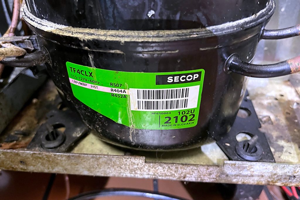 Secop TF4CLX hermetic compressor with its green label showing R-404A, R-507 and R-452A ratings