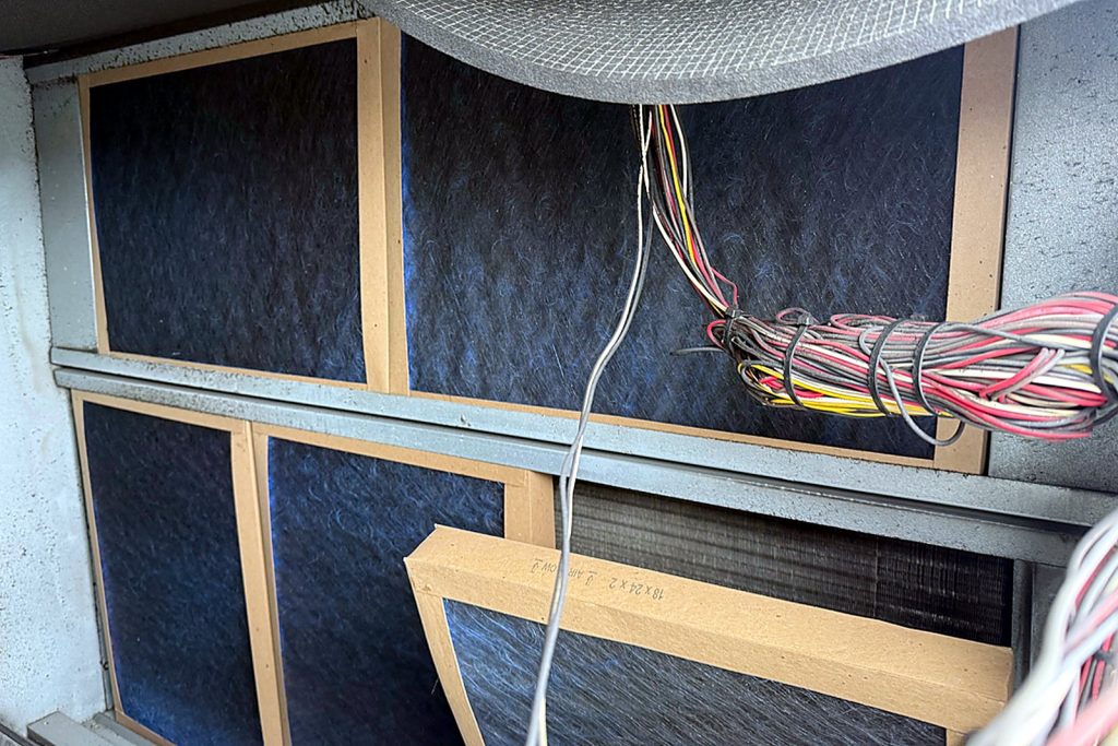 New 18x24x2 pleated filters in the rack, coil behind them.