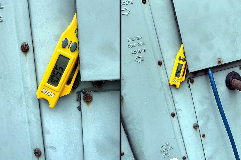 Two pocket thermometers clipped to the rooftop unit panels reading 55.0 and 58 degrees Fahrenheit
