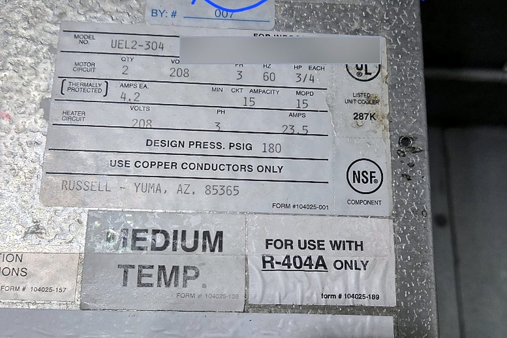Data plate of a Russell UEL2-304 medium temperature unit cooler, 208 volt three phase, for use with R-404A, with the serial number redacted